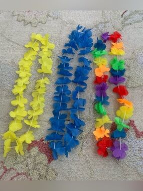 Three artificial Hawaiian flower leis